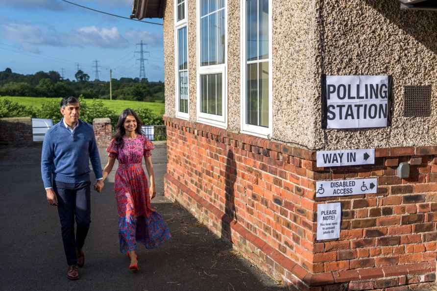 Rishi Sunak walks to a polling station