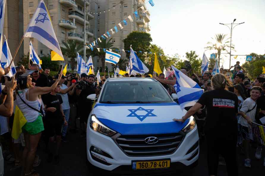 Friends and relatives welcome Almog Meir Jan, 22, who was rescued...