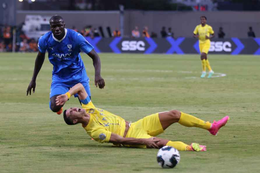 Al-Nassr's Cristiano Ronaldo, falls on the ground following an action...