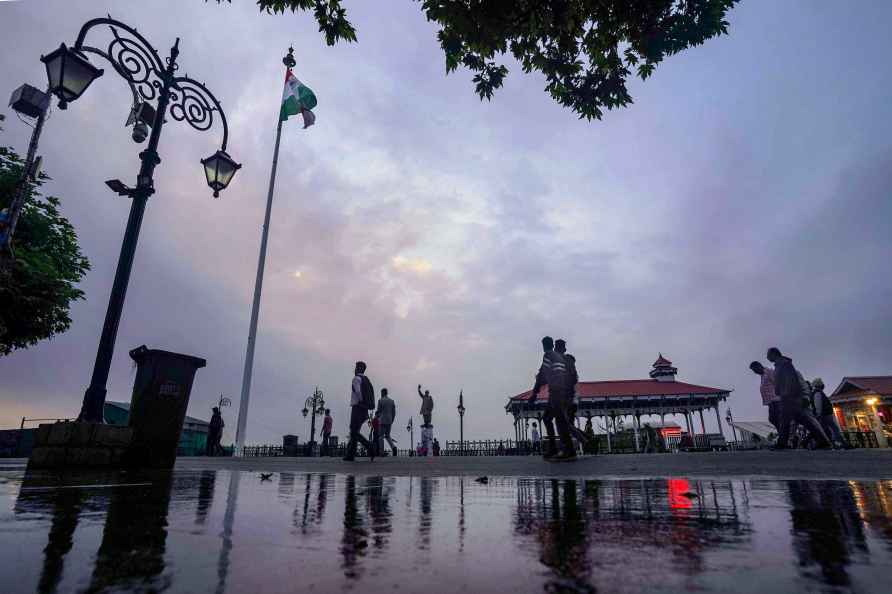 Shimla: People take a stroll under the cloudy sky in Shimla, Tuesday...