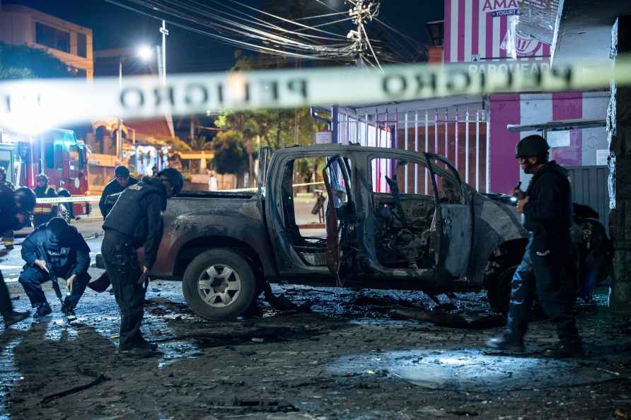 Police inspect a truck that exploded in Quito, Ecuador