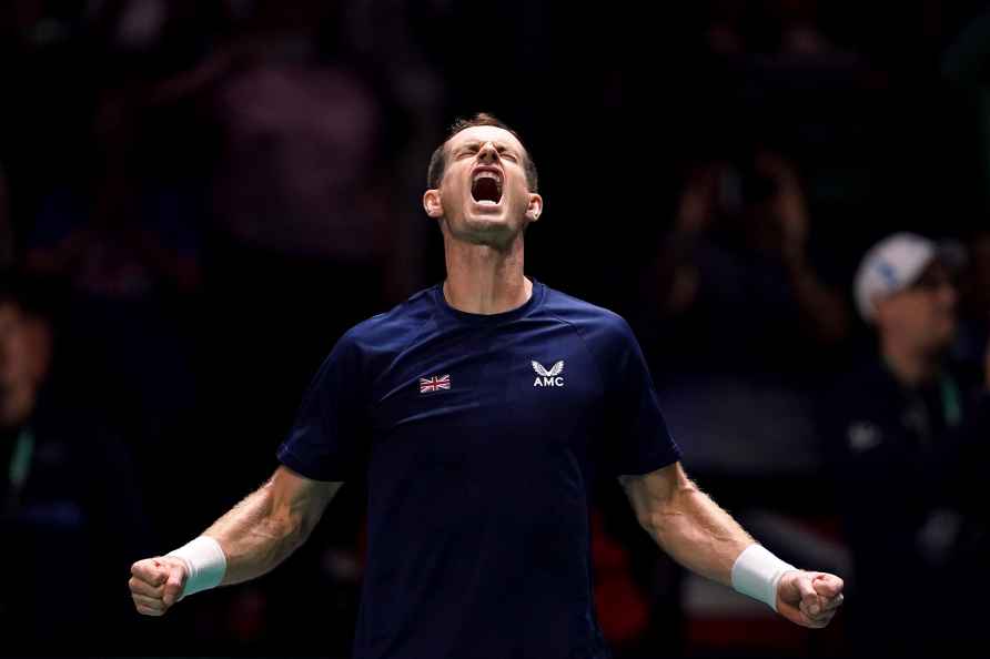 Great Britain's Andy Murray celebrates beating Switzerland's Leandro...