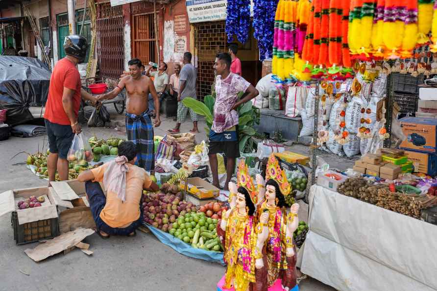 Kolkata: Devotees purchase 'puja' for Vishwakarma Puja, in Kolkata...