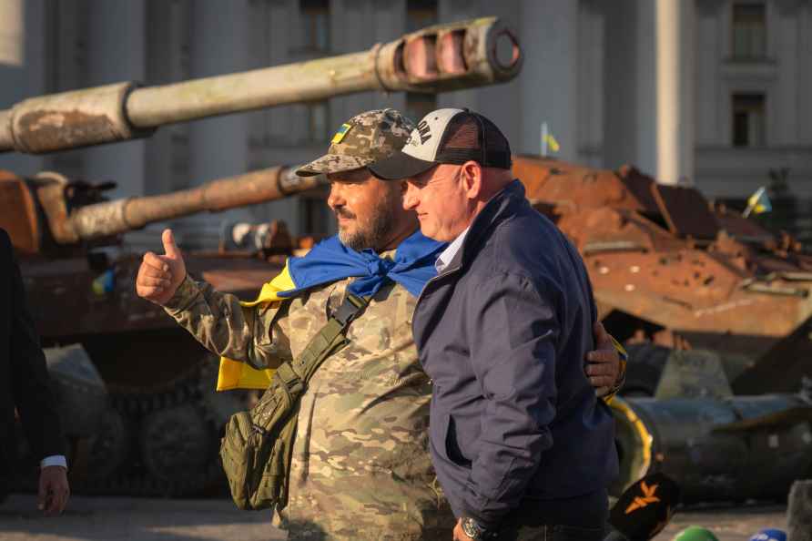 U.S. Sen. Mark Kelly, D-Ariz., and a Ukrainian soldier