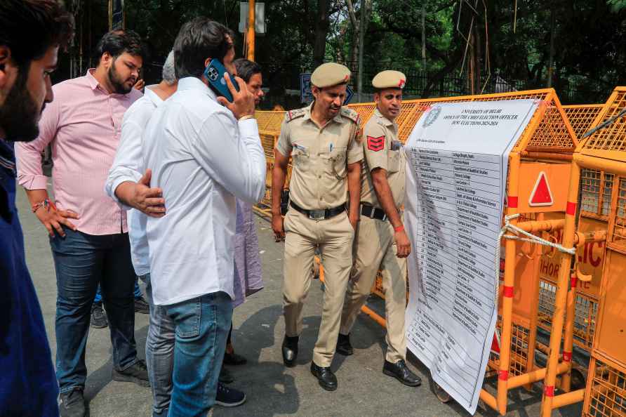 New Delhi: Police personnel stand guard outside a counting center...