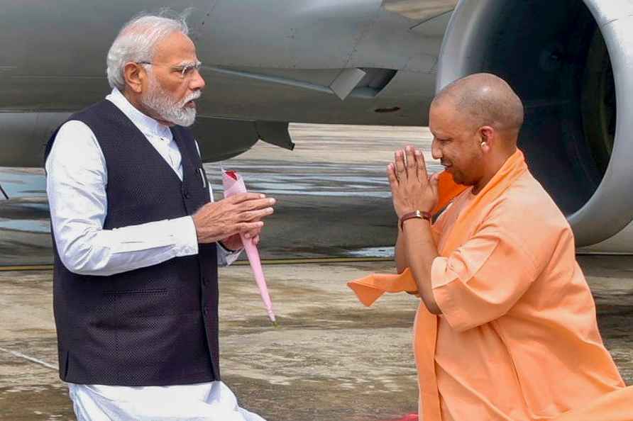 **EDS: IMAGE VIA @myogiadityanath** Varanasi: Prime Minister Narendra...