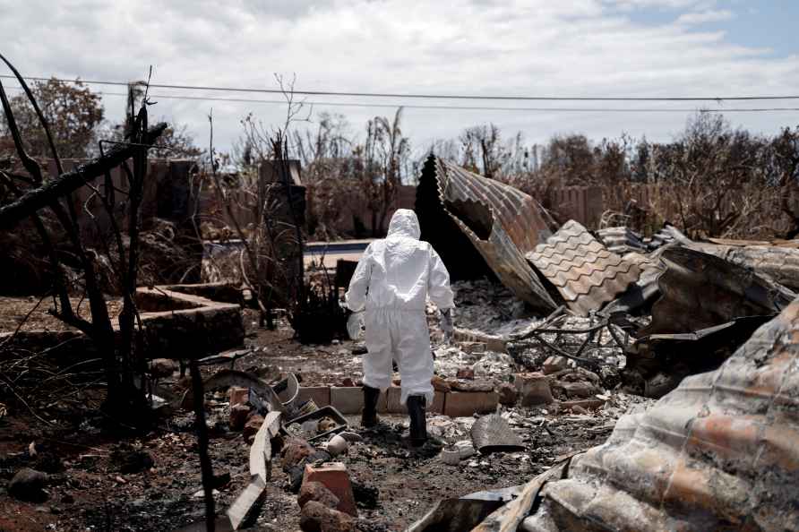 A resident visits her property after deadly wildfire