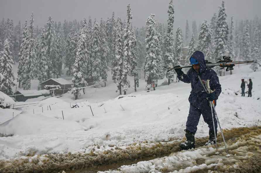 EDS: FILE IMAGE TO GO WITH STORY** Gulmarg: A skier walks on a snow...