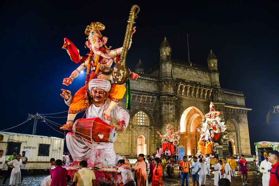 Mumbai: Devotees take part in a procession for immersion of Lord...