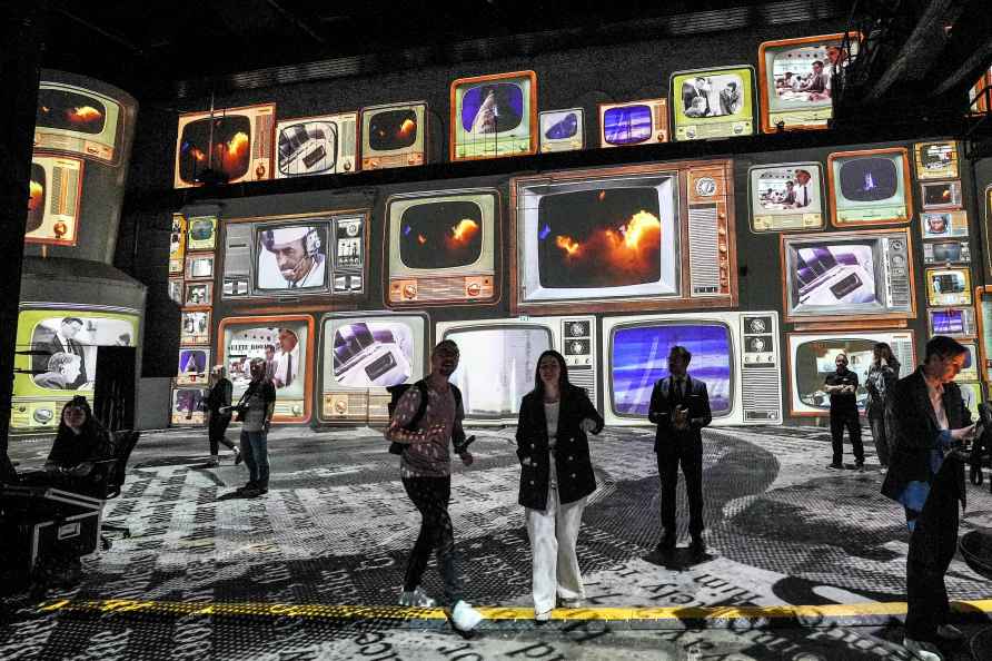 People watch the preview of the new digital exhibition 