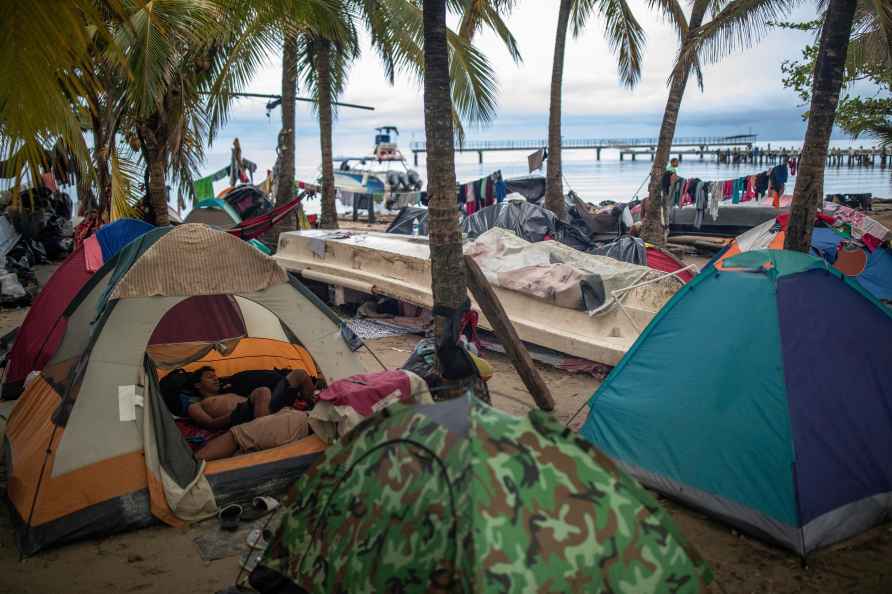 Migrants camp on beach in Necocli,