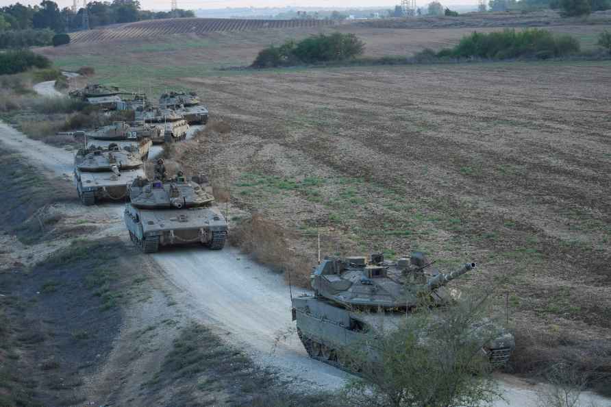 Israeli tanks move near the Israeli Gaza border