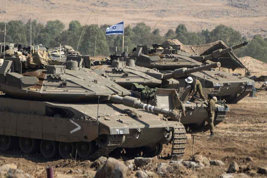 Israeli tanks are stationed near the border