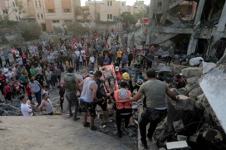 Palestinians evacuates a survivor from a destroyed house