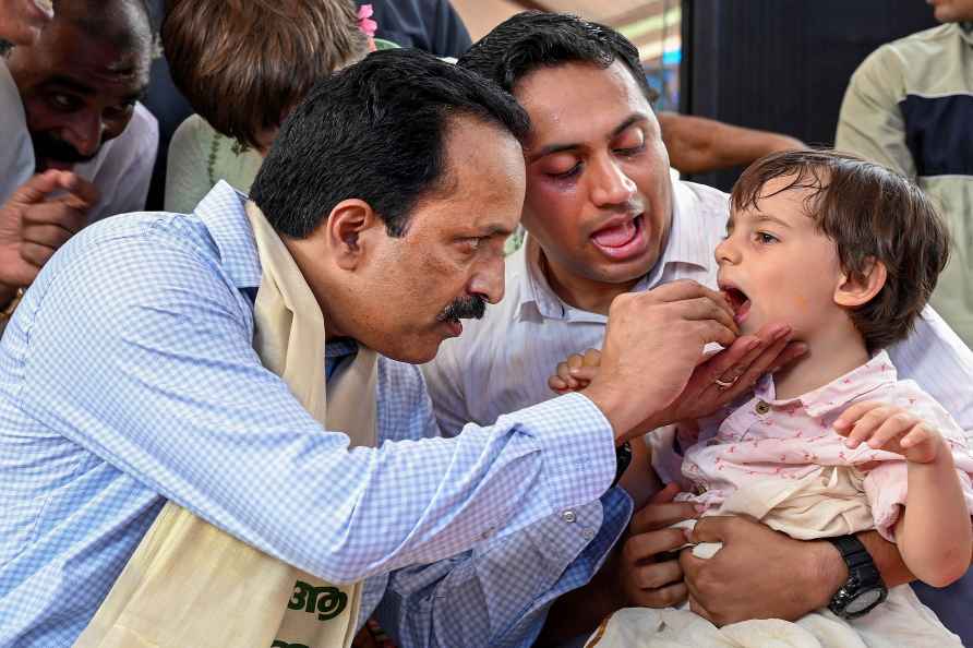 S Somanath initiates a child on Vidyarambham