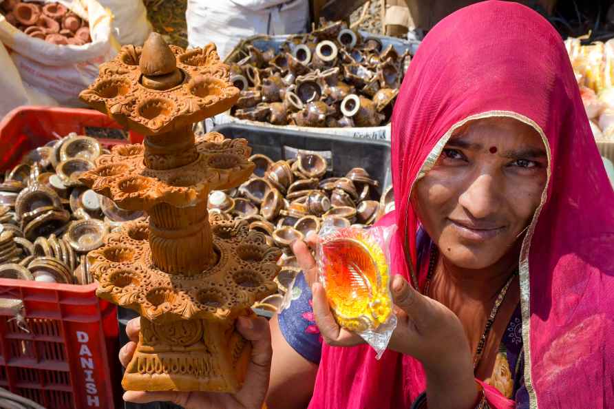 Nagpur: A street vendor sells earthen lamps ahead of the Diwali ...