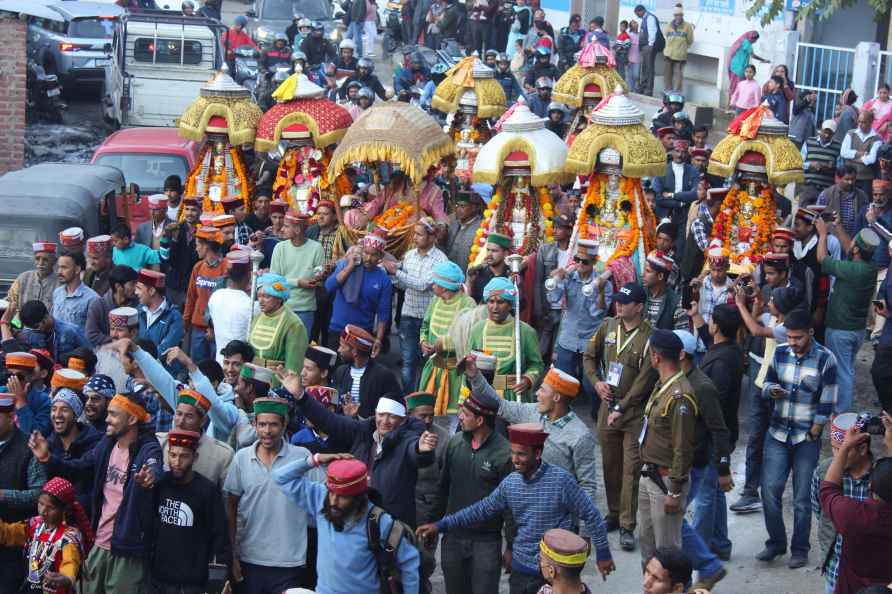 Kullu: Devotees carry deities in planqins during the week-long International...