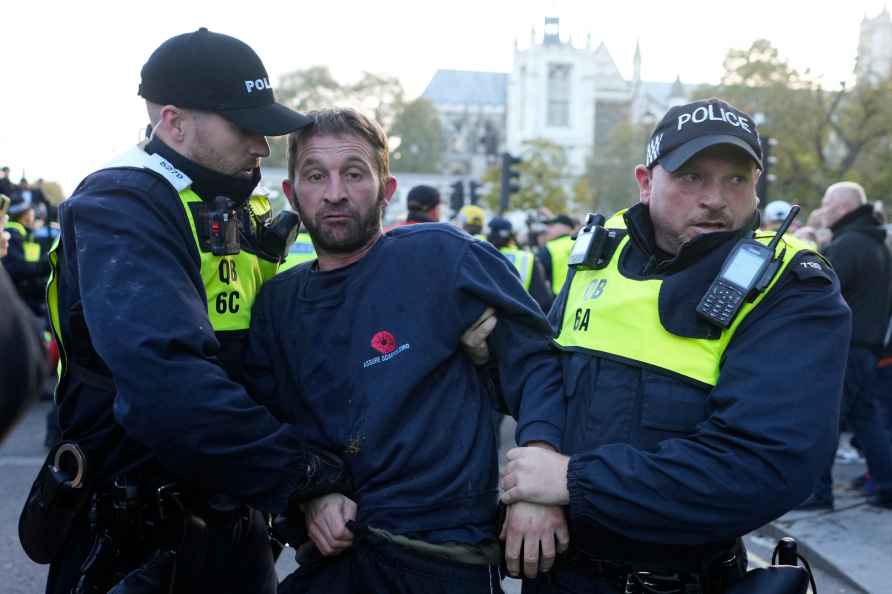 Counter-protester is detained by police in Parliament Square