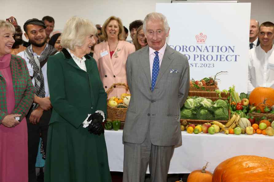 Britain's King Charles III, centre and Queen Camilla visit Fare ...