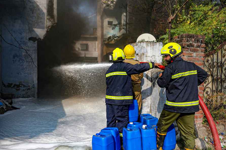 Jammu: Firefighters attempt to douse a fire that broke out at a ...