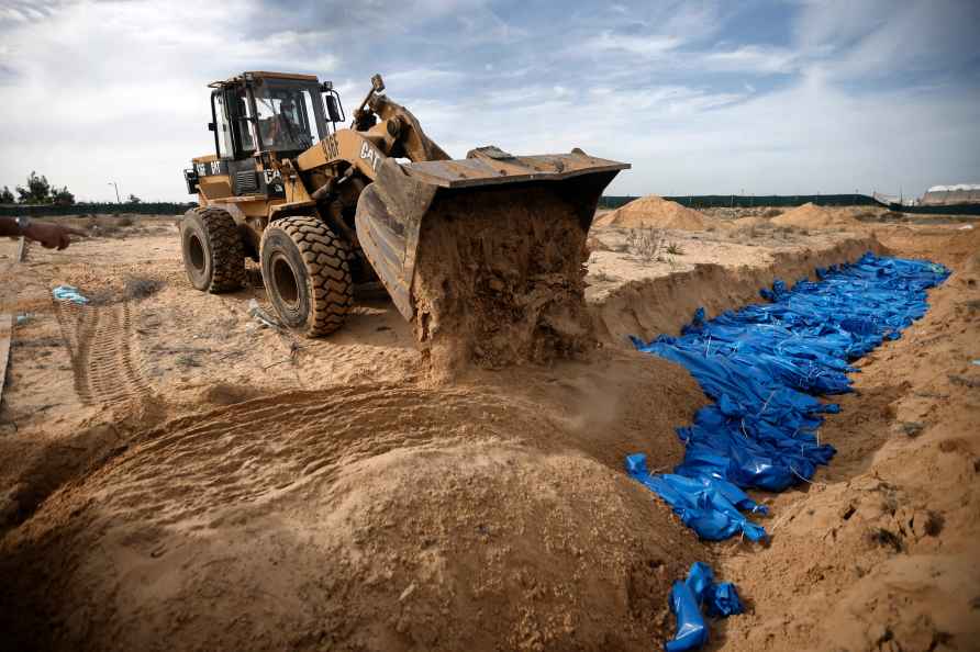 Palestinians bury people killed in the Israeli bombardment