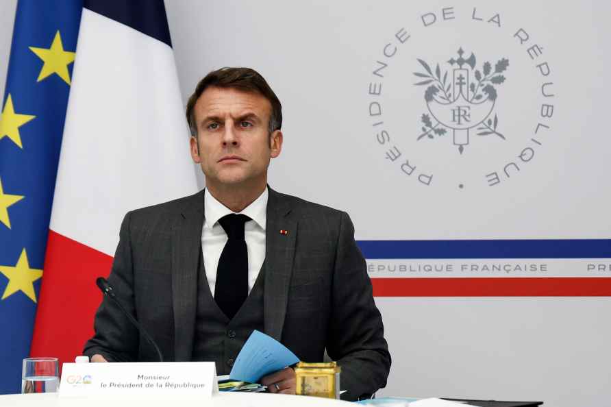 French President Emmanuel Macron attends a video-conference with...