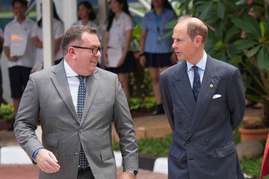 Britain's Prince Edward, Duke of Edinburgh, right, speaks with Principal...