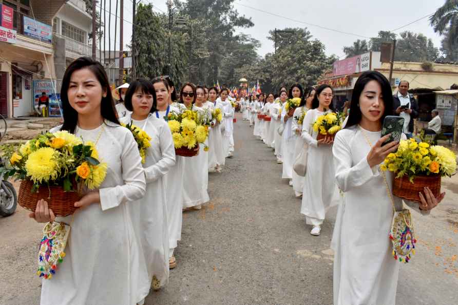 Varanasi: Devotees take part in a procession on Buddha Purnima, ...