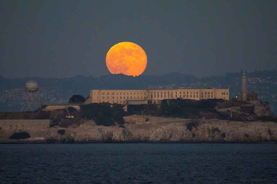 Beaver Moon, rises above Alcatraz Island