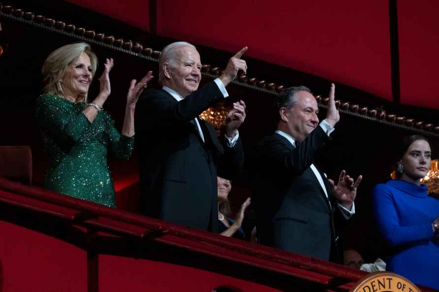 President Joe Biden, first lady Jill Biden, and Doug Emhoff, the...