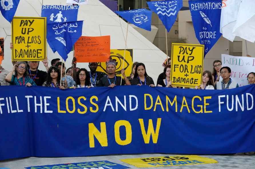 Activists demonstrate for the loss and damage fund