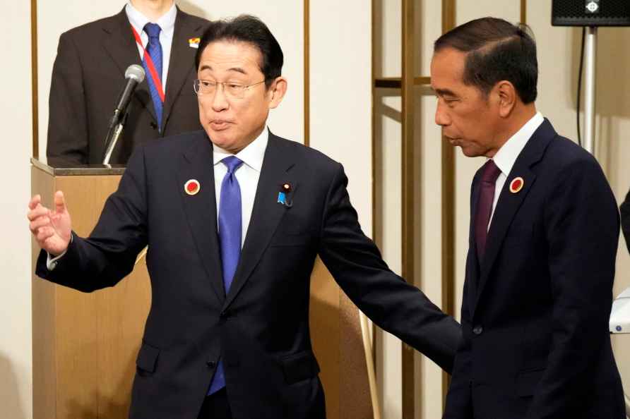 Indonesian President Joko Widodo, right, is escorted by Japan's ...