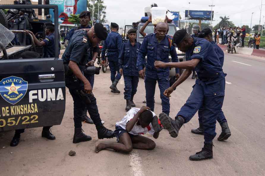 Security forces assault a supporter of presidential candidate Martin...