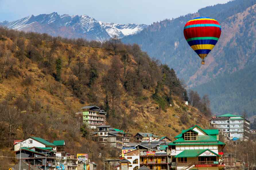 Manali: Tourists ride on a hot air balloon, in Manali, Friday, Jan...