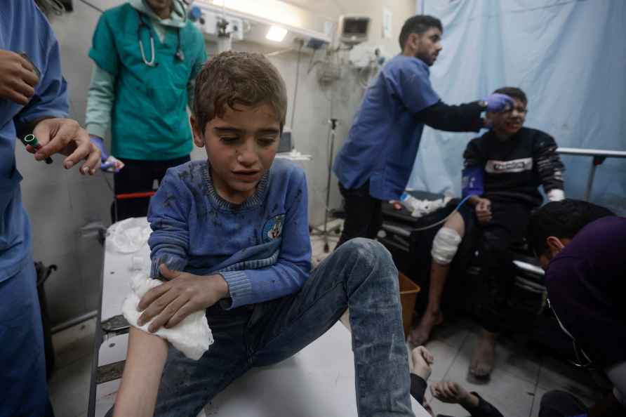 Palestinians wounded in Israeli bombardment, receive treatment at...