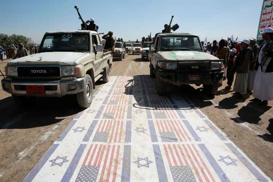 Houthi fighters stage a rally