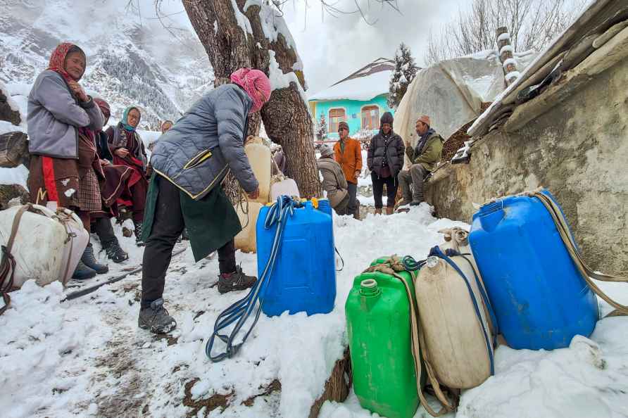 Residents collect water amid snowfall