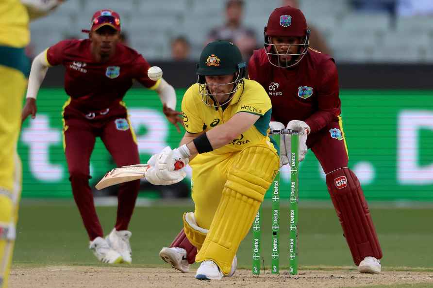 Australia's Josh Inglis, center, plays a shot that will have him...