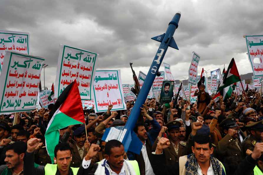 Houthi supporters attend a rally