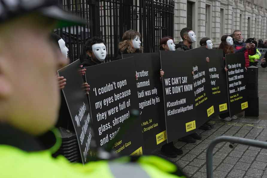 Protesters from Amnesty International stage