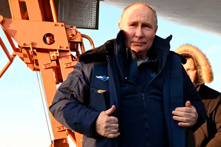 Russian President Vladimir Putin gets off a Tu-160M strategic bomber...