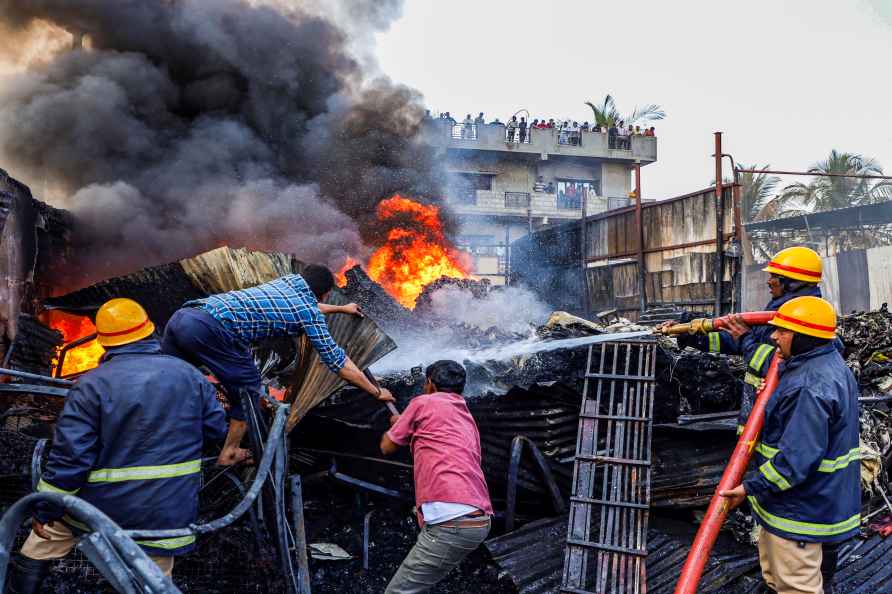 Bengaluru: Firefighters and residents try to douse a fire which ...