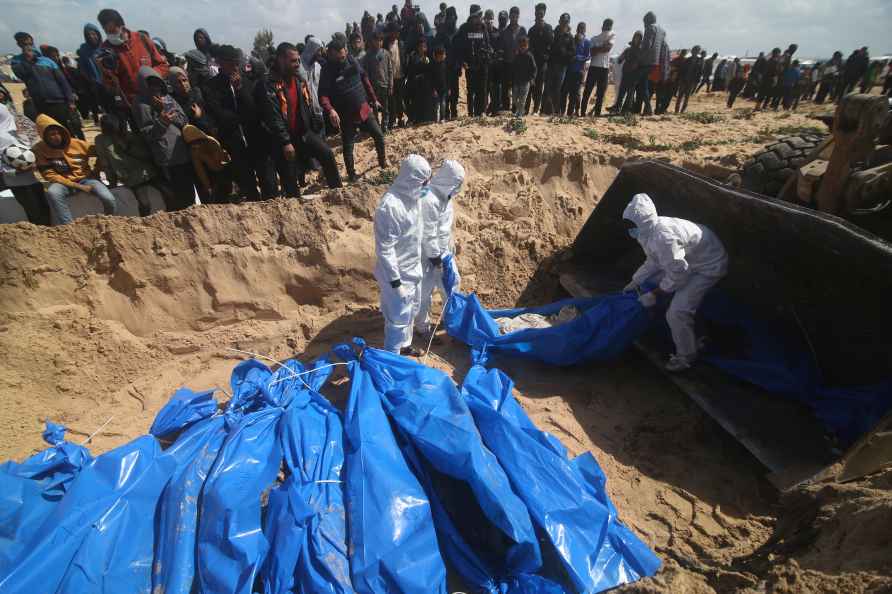 Palestinians attend a mass funeral