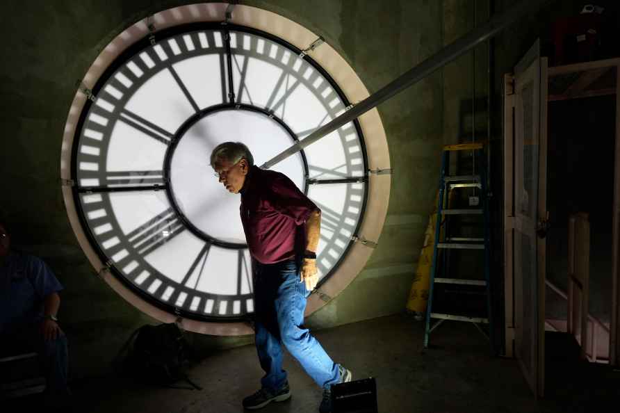 Don Bugh walks inside the historic clock tower atop the Dallas County...