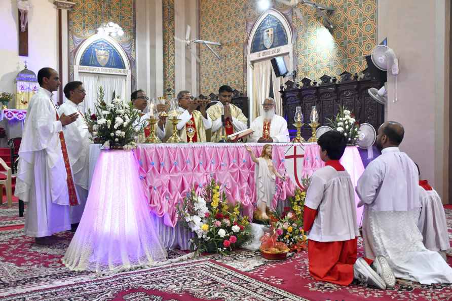 Prayagraj: Christian priests and devotees pray at St. Joseph's Cathedral...