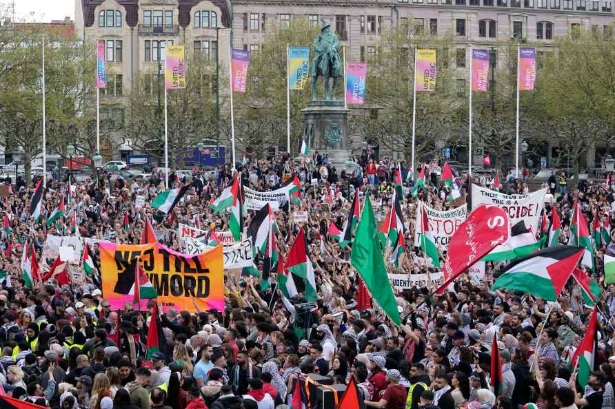 Pro-Palestinian demonstrators gather for a protest against the participation...