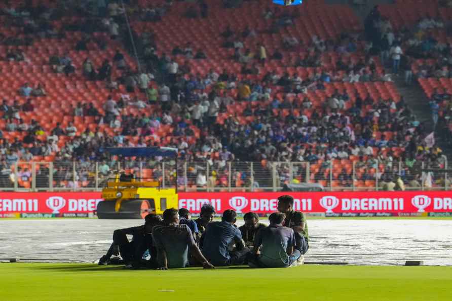 Ahmedabad: Groundsmen wait on the field after the Indian Premier...