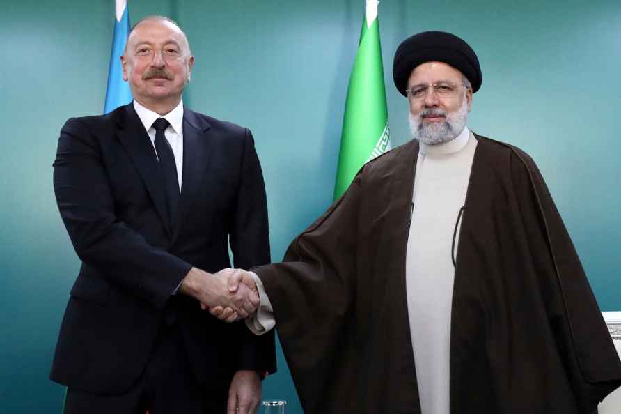 President Ebrahim Raisi shakes hands with his Azeri counterpart Ilham Aliyev