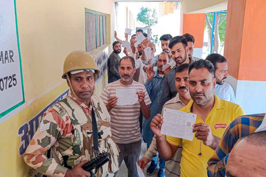 Rajouri: People wait to cast votes at a polling station during sixth...