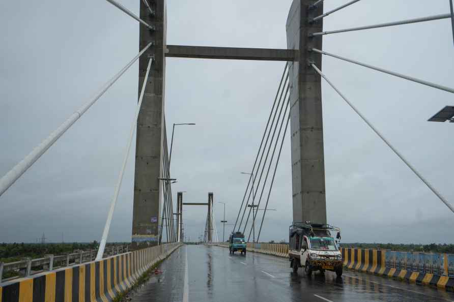 South 24 Parganas: Vehicles move on a bridge, ahead of the landfall...